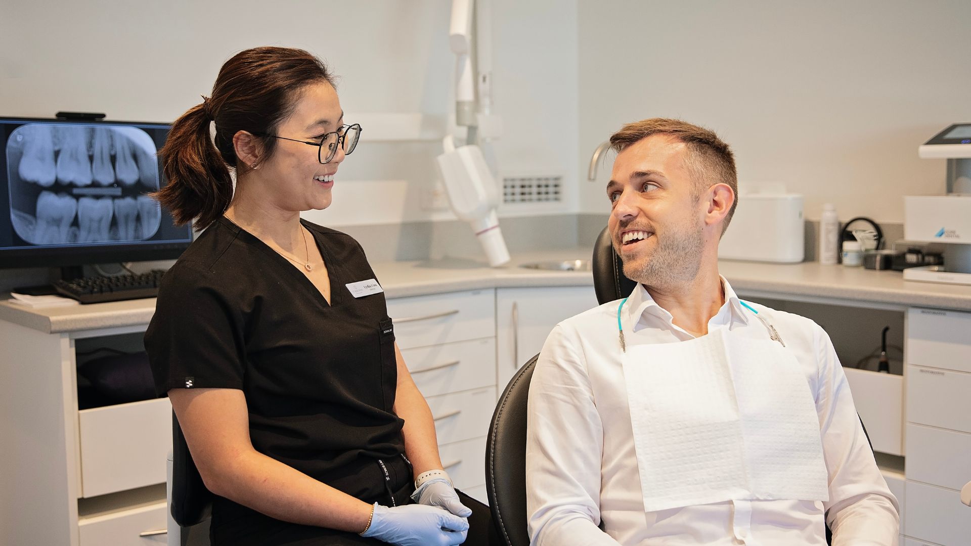 Patient smiling with a gentle dentist in Christchurch during a relaxed dental consultation