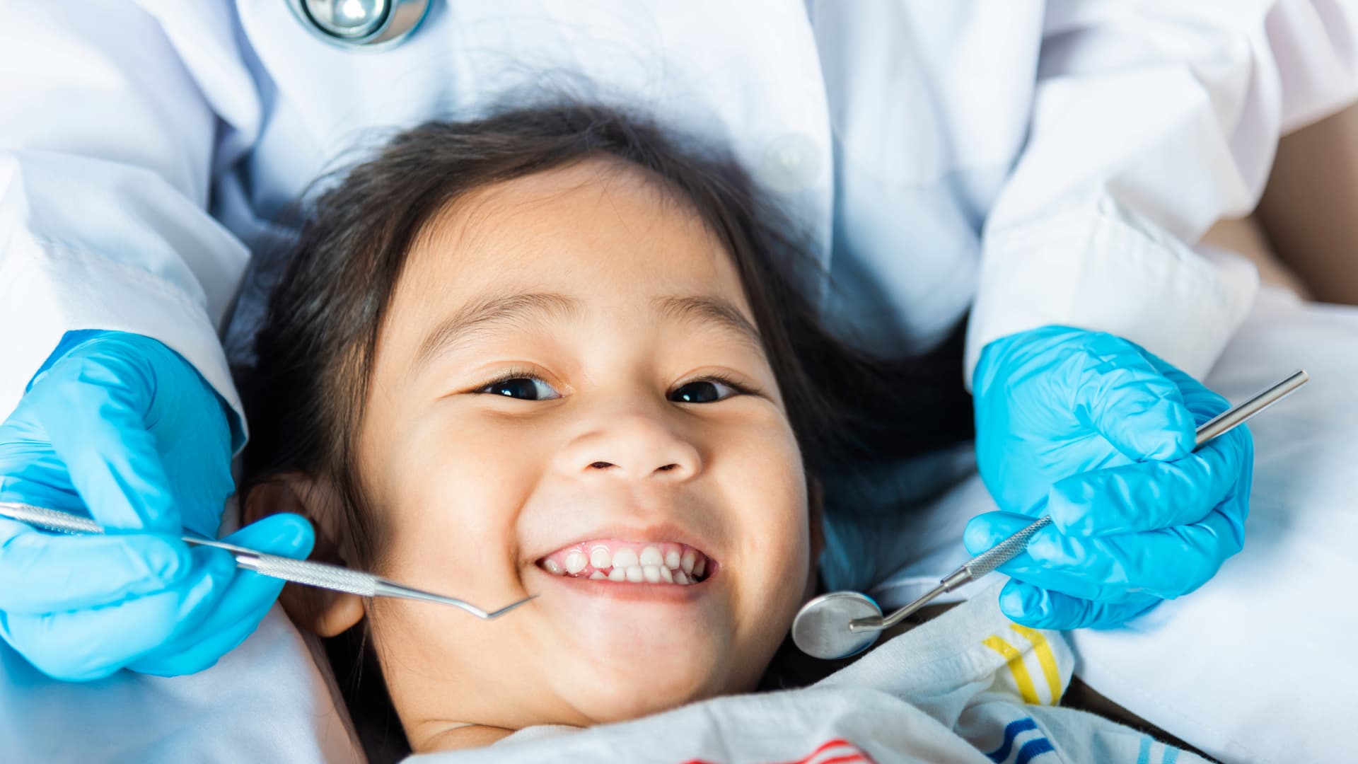 Smiling child at dental check-up with a dentist for child near me